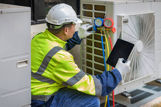 Professional Air Conditioning Repair technician working in Urbana, IA